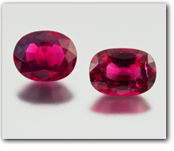 Robert Weldon - A pair of faceted natural ruby crystals